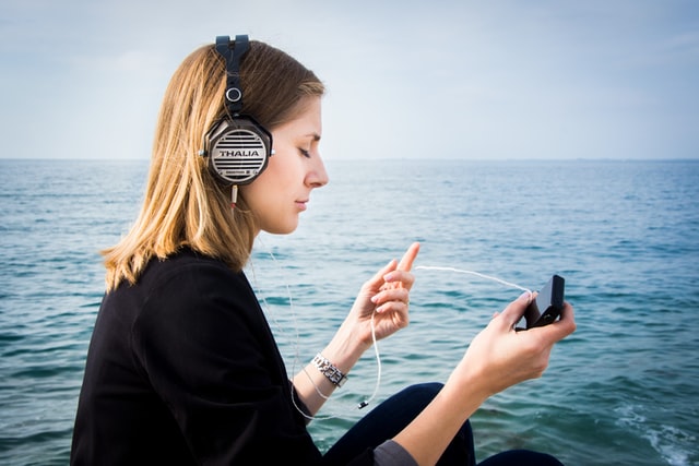 Top safety tips for women travellers - Listening music